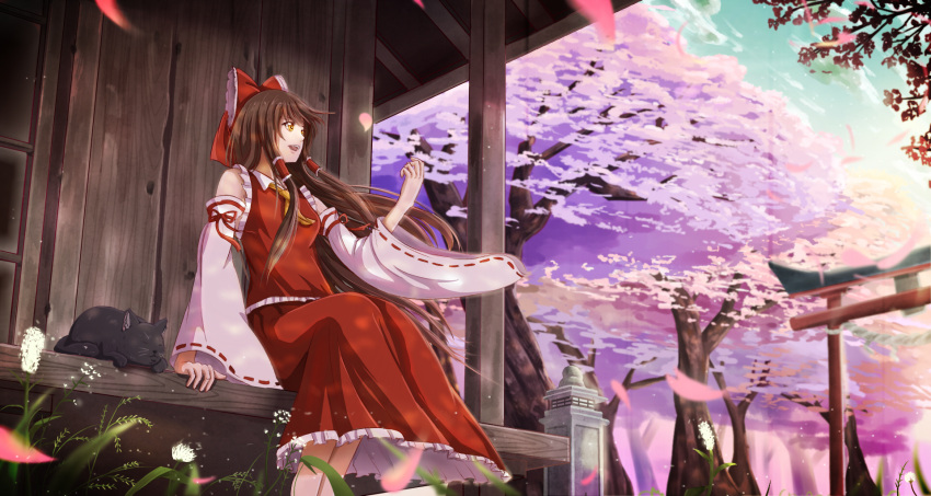 1girl :d animal architecture bangs black_cat blurry bow brown_eyes building cat cherry_blossoms detached_sleeves east_asian_architecture flower frills grass hair_bow hair_tubes hakurei_reimu highres long_hair manoma motion_blur open_mouth outdoors petals plant red_bow red_ribbon red_skirt ribbon ribbon-trimmed_sleeves ribbon_trim sitting skirt skirt_set sky smile solo torii touhou tree veranda vest white_flower wind