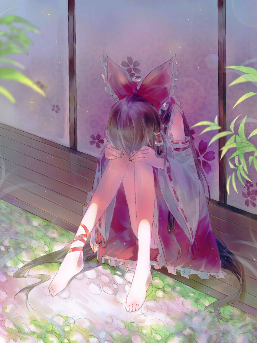 1girl ankle_ribbon architecture atuan barefoot brown_hair commentary detached_sleeves east_asian_architecture full_body hair_ribbon hair_tubes hakurei_reimu head_rest highres japanese_clothes light_particles long_hair long_sleeves miko ribbon sad sitting skirt solo touhou very_long_hair wide_sleeves