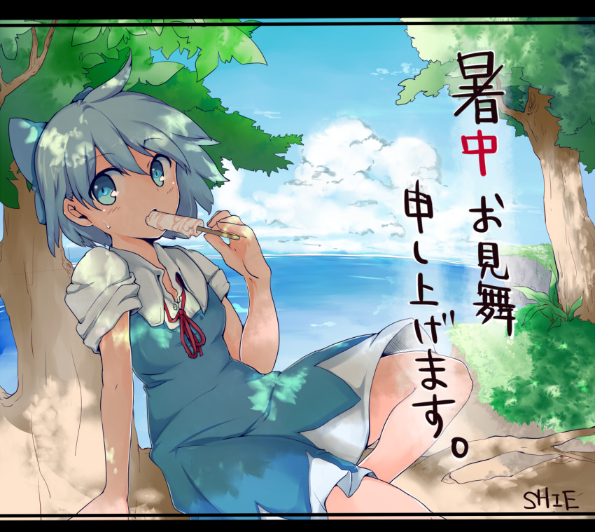 1girl artist_name blue_dress blue_eyes blue_hair blue_sky bow cirno clouds dress grass hair_bow highres in_tree letterboxed ocean popsicle shie320 sitting sitting_in_tree sky solo sweatdrop touhou translated tree tree_shade