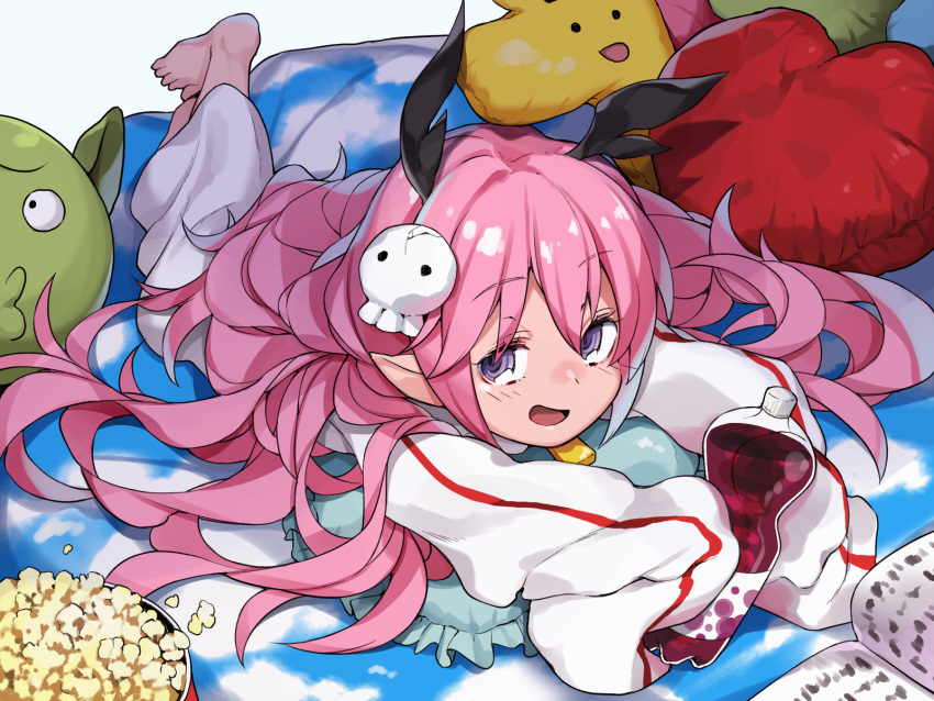 1girl barefoot blush book bottle cushion full_body hair_ornament heart highres holding long_hair looking_at_viewer lying nose_blush on_stomach open_book open_mouth outstretched_arms pink_hair pointy_ears popcorn ruki_(senyuu) sen'yuu. shooru skull_hair_ornament sleeves_past_wrists solo