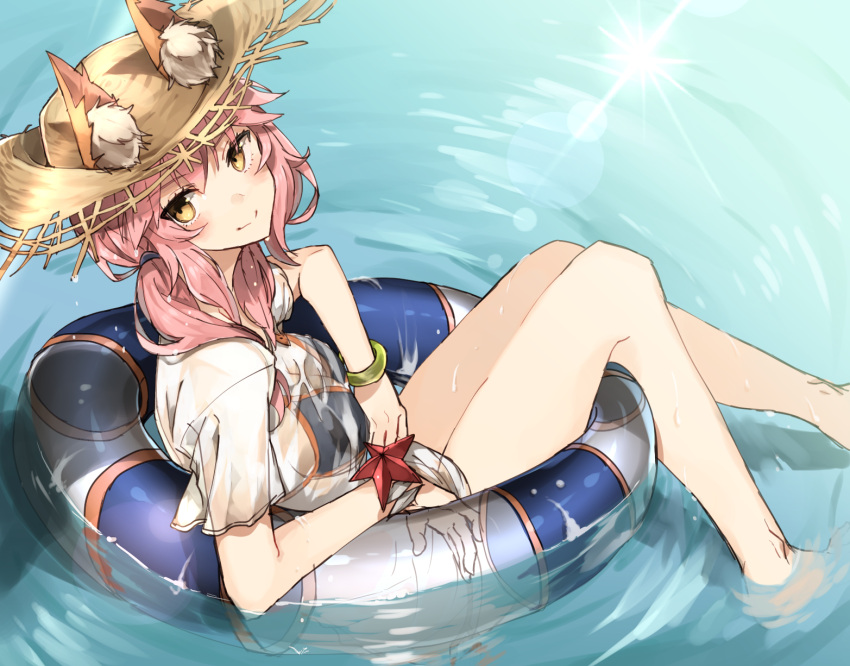 1girl animal_ears bikini blue_bikini blush caster_(fate/extra) chibirisu fate/grand_order fate_(series) floating fox_ears hat highres innertube long_hair looking_at_viewer pink_hair see-through shirt smile solo straw_hat swimsuit wet wet_clothes wet_shirt yellow_eyes