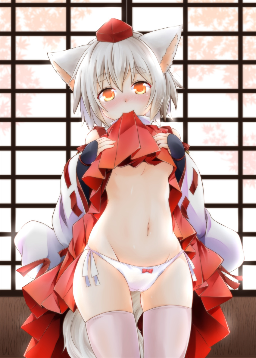 1girl animal_ears bare_shoulders blush bow bow_panties breasts clothes_lift commentary_request detached_sleeves eyebrows glowing glowing_eyes groin hakama hat head_tilt highres inubashiri_momiji japanese_clothes kneeling lifted_by_self long_sleeves looking_at_viewer mouth_hold navel no_bra nose_blush orange_eyes panties red_bow short_hair side-tie_panties silver_hair small_breasts smile solo stomach tail thick_eyebrows thigh-highs tokin_hat touhou tree_shade under_boob underwear white_legwear white_panties wide_sleeves wolf_ears wolf_girl wolf_tail yozuki_shokora