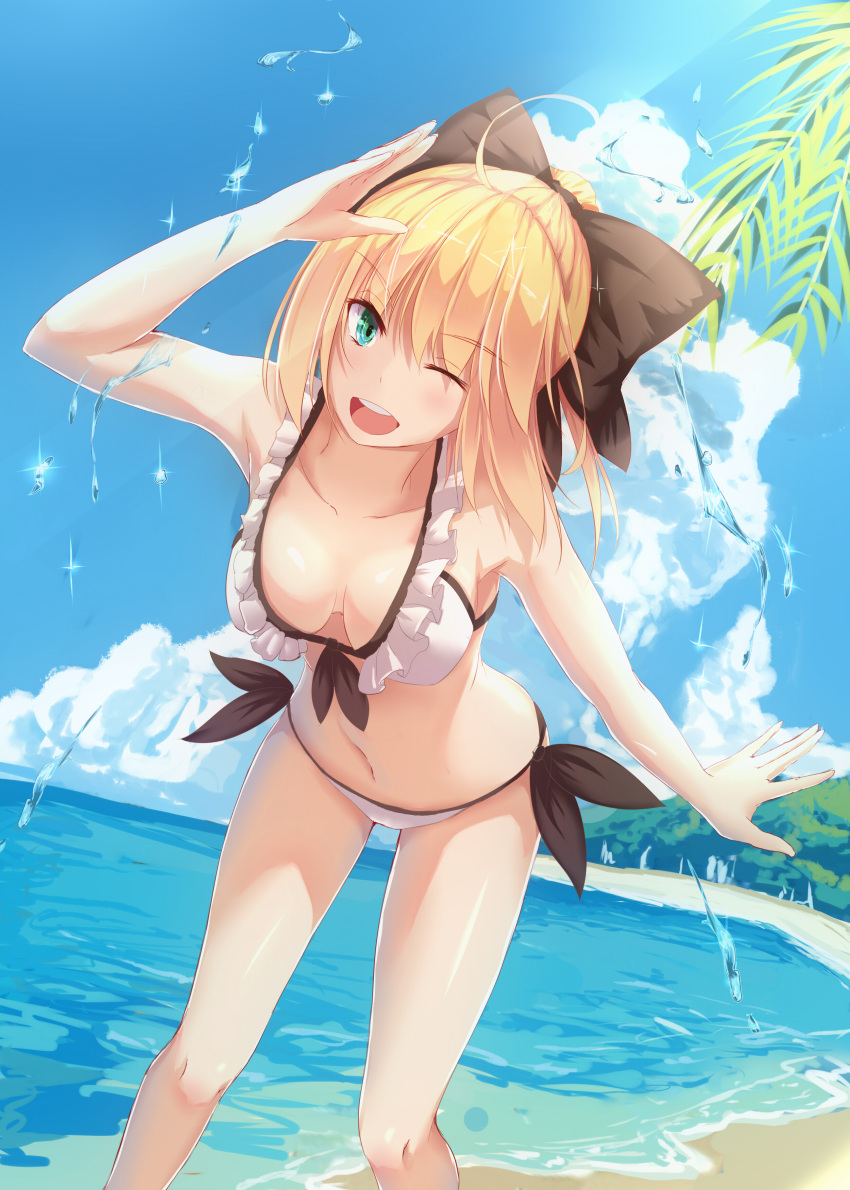 1girl ;d absurdres adapted_costume ahoge bakanoe bangs bare_arms bent_over bikini black_bow blonde_hair blue_sky bow breasts cleavage clouds collarbone day dutch_angle eyebrows eyebrows_visible_through_hair fate/grand_order fate_(series) frills green_eyes highres legs_apart looking_at_viewer medium_breasts navel ocean one_eye_closed open_mouth outdoors ponytail saber saber_lily salute shade side-tie_bikini sky smile solo sparkle standing stomach swimsuit water white_bikini