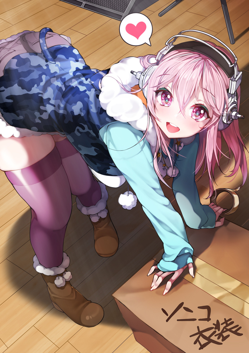 1girl bending_forward blush box breasts camouflage_hoodie cardboard_box commentary_request fur_trim headphones heart heart-shaped_pupils highres kanola_u large_breasts long_hair looking_at_viewer nitroplus open_mouth pink_eyes pink_hair pom_pom_(clothes) skindentation sleeveless sleeveless_hoodie smile solo spoken_heart super_sonico symbol-shaped_pupils tape thigh-highs zettai_ryouiki