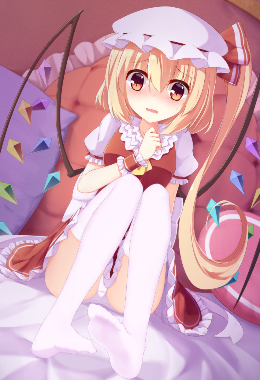 1girl arm_at_side ascot bed bed_sheet blonde_hair blush breasts ddt_(darktrident) embarrassed eyebrows eyebrows_visible_through_hair flandre_scarlet frilled_shirt_collar frilled_skirt frilled_sleeves frills hair_between_eyes hand_up hat hat_ribbon heart heart_pillow highres knees_up long_hair mob_cap nail_polish nose_blush on_bed open_mouth panties pantyshot pantyshot_(sitting) pillow puffy_short_sleeves puffy_sleeves red_eyes red_nails ribbon shirt short_sleeves side_ponytail sitting sitting_on_bed skirt skirt_set solo sweatdrop thigh-highs touhou underwear vest white_background white_legwear white_panties wings wrist_cuffs