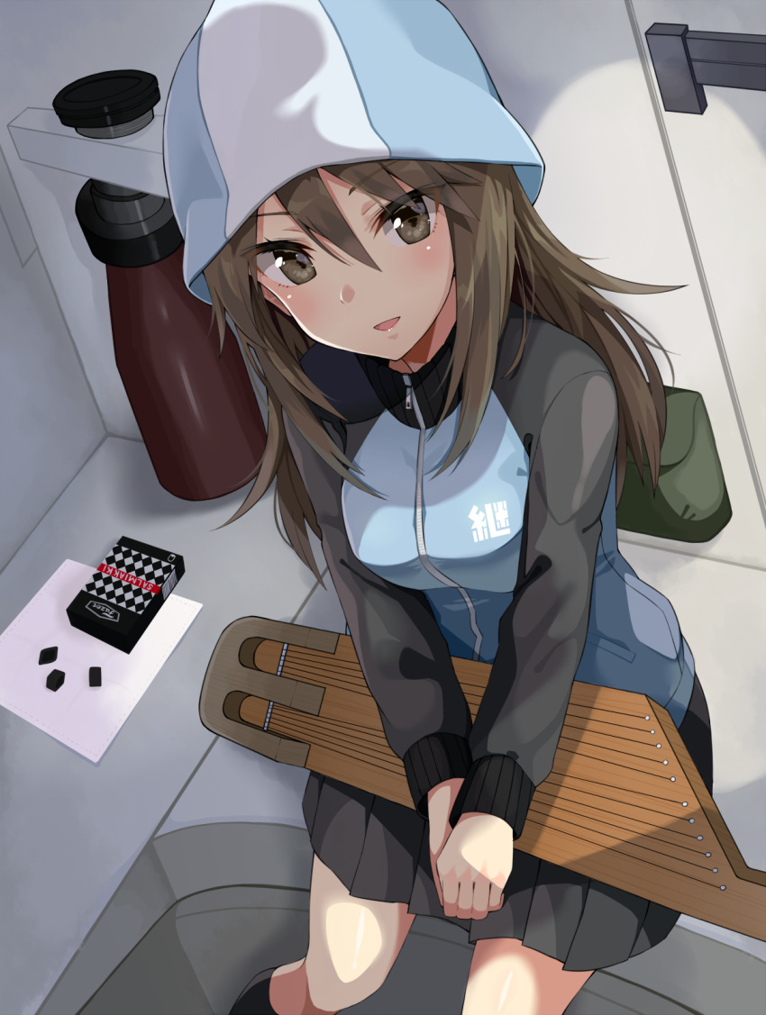 1girl :d blue_jacket blush brown_eyes brown_hair candy commentary_request eyebrows eyebrows_visible_through_hair from_above girls_und_panzer gomashi_(goma) hair_between_eyes hands_together hat highres inside instrument jacket kantele long_hair long_sleeves looking_at_viewer mika_(girls_und_panzer) open_mouth pleated_skirt salmiakki sitting skirt smile solo track_jacket v_arms