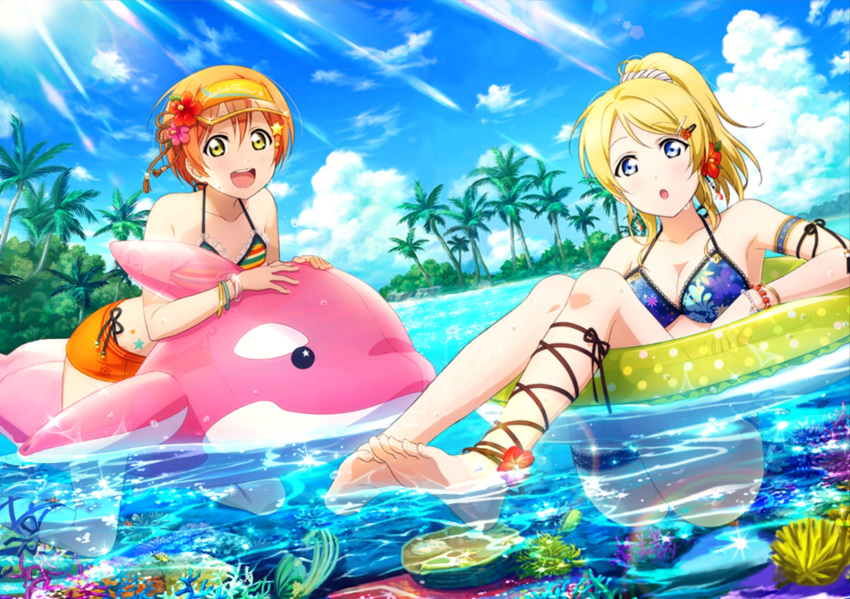 2girls ayase_eli bare_shoulders barefoot bikini bikini_shorts bikini_top blonde_hair blue_eyes coral feet floral_print flower green_eyes hair_flower hair_ornament hairclip highres hoshizora_rin inflatable_toy innertube island looking_at_viewer love_live! love_live!_school_idol_festival love_live!_school_idol_project multiple_girls official_art open_mouth orange_hair partially_submerged ponytail short_hair shorts sky smile soles string_bikini swimsuit toes visor_cap water