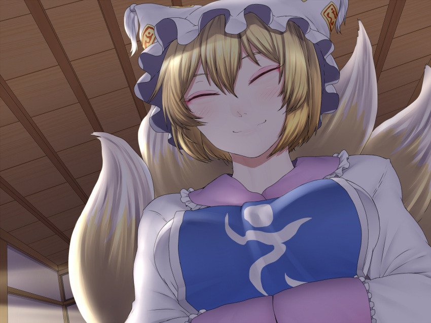 1girl bangs blonde_hair blush breasts ceiling close-up closed_eyes dress dutch_angle eyelashes eyeliner eyeshadow fox_tail hair_between_eyes half-closed_eyes hands_together hat highres indoors light light_trail long_sleeves looking_at_viewer makeup medium_breasts multiple_tails night ninonini pillow_hat pov shiny shiny_hair short_hair sleeves_together smile solo tabard tail touhou upper_body white_dress yakumo_ran
