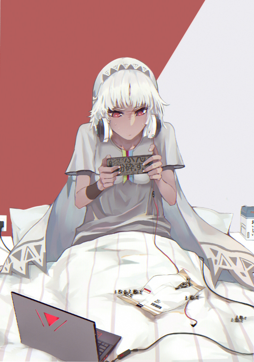 1girl absurdres altera_(fate) alternate_costume blanket candy candy_wrapper commentary_request computer dark_skin fate/extella fate/extra fate_(series) food grey_shirt headphones headphones_around_neck highres holding laptop long_hair pillow playing_games red_eyes reroi shirt sitting solo sweat two-tone_background under_covers veil white_hair