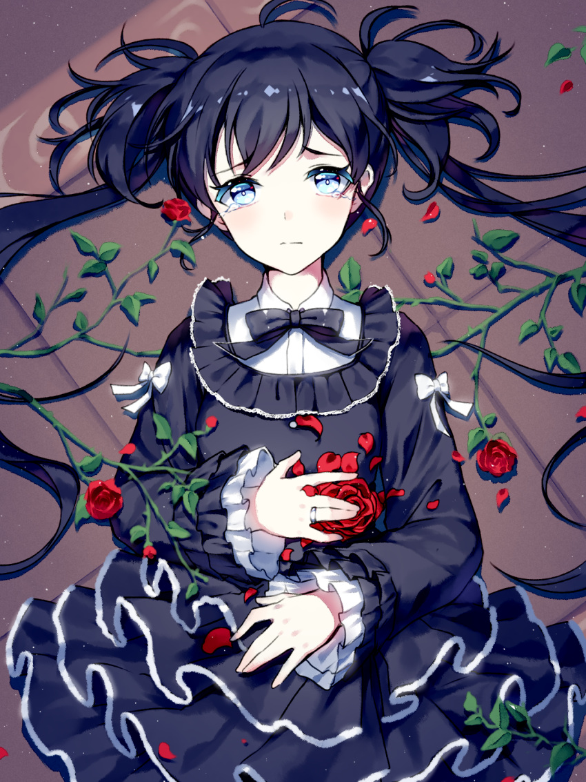 1girl bangs black_dress black_hair blue_eyes blush closed_mouth crying crying_with_eyes_open dress flower frilled_sleeves frills from_above frown gothic_lolita highres jewelry layered_dress lolita_fashion long_hair long_sleeves looking_at_viewer lying mechuragi on_back original petals plant red_rose ring rose solo tears tile_floor tiles twintails vines