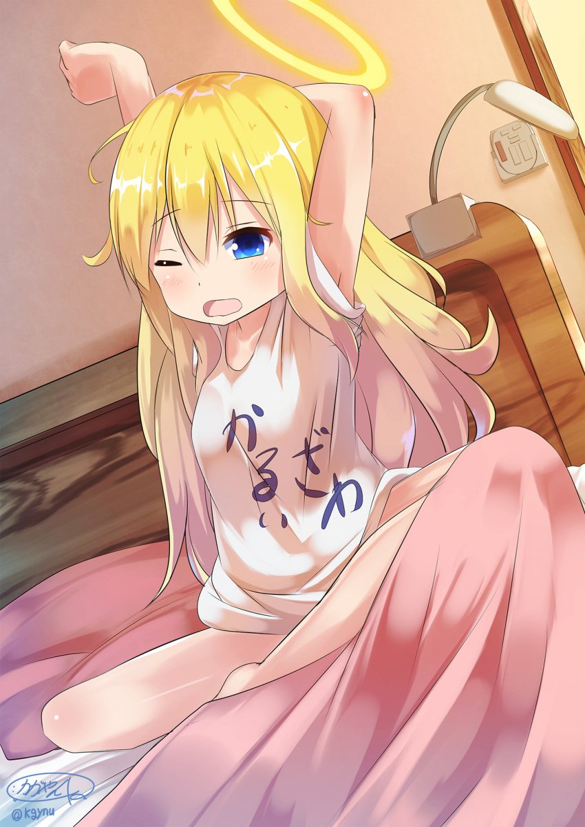 1girl arm_behind_head arm_up artist_name barefoot blonde_hair blue_eyes clothes_writing dutch_angle gabriel_dropout halo highres indian_style kagayan1096 long_hair on_bed one_eye_closed open_mouth shirt signature sitting solo stretch t-shirt tenma_gabriel_white twitter_username waking_up wavy_mouth