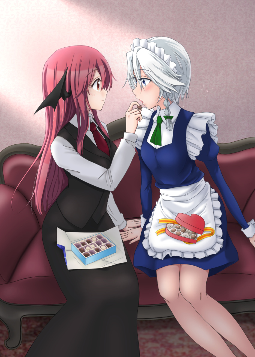 2girls 3692materia apron black_skirt blue_dress blue_eyes braid chocolate couch dress dress_shirt eye_contact feeding hair_ribbon head_wings heart-shaped_box highres indoors izayoi_sakuya juliet_sleeves koakuma light_smile long_hair long_sleeves looking_at_another maid_headdress multiple_girls necktie open_mouth puffy_sleeves red_eyes red_necktie redhead ribbon shirt short_hair silver_hair sitting skirt touhou tress_ribbon twin_braids waist_apron waistcoat yuri