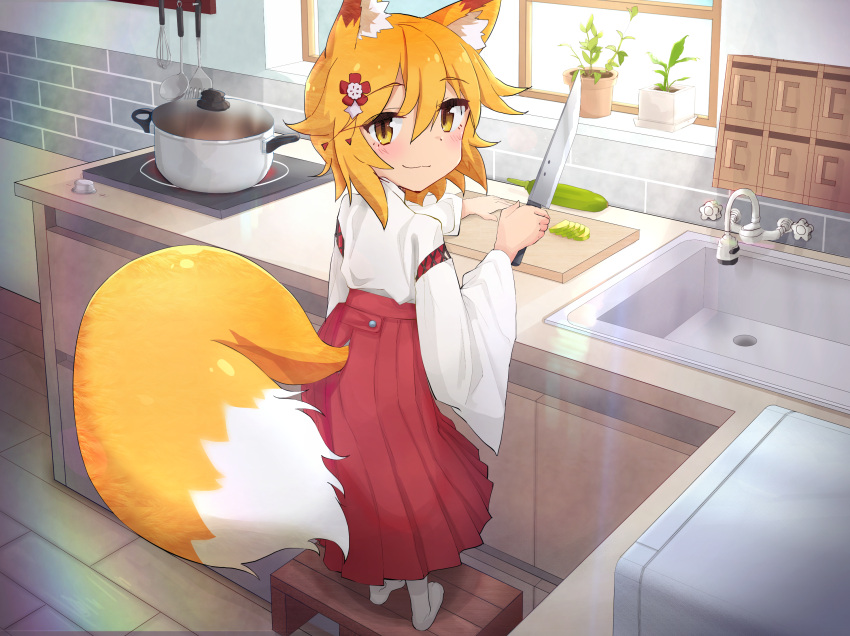 1girl animal_ear_fluff animal_ears blonde_hair blush cooking cutting_board flower fox_ears fox_girl fox_tail hair_flower hair_ornament hakama highres holding holding_knife indoors japanese_clothes kimono kitchen knife looking_at_viewer looking_back miko n3moni pot red_flower red_hakama senko_(sewayaki_kitsune_no_senko-san) sewayaki_kitsune_no_senko-san sink stove tail tail_raised white_kimono white_legwear yellow_eyes