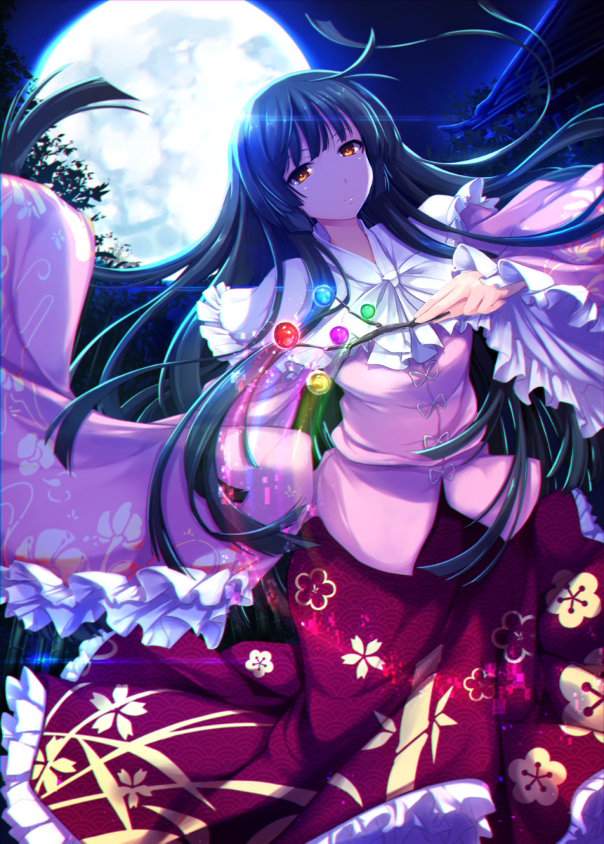 1girl backlighting bamboo bamboo_forest black_hair blouse branch closed_mouth cowboy_shot floral_print forest full_moon highres hime_cut houraisan_kaguya japanese_clothes jeweled_branch_of_hourai long_hair long_skirt long_sleeves looking_at_viewer moon moonlight nature night orange_eyes ouma_tokiichi outdoors pink_blouse print_skirt red_skirt skirt sleeves_past_wrists smile solo touhou very_long_hair wide_sleeves