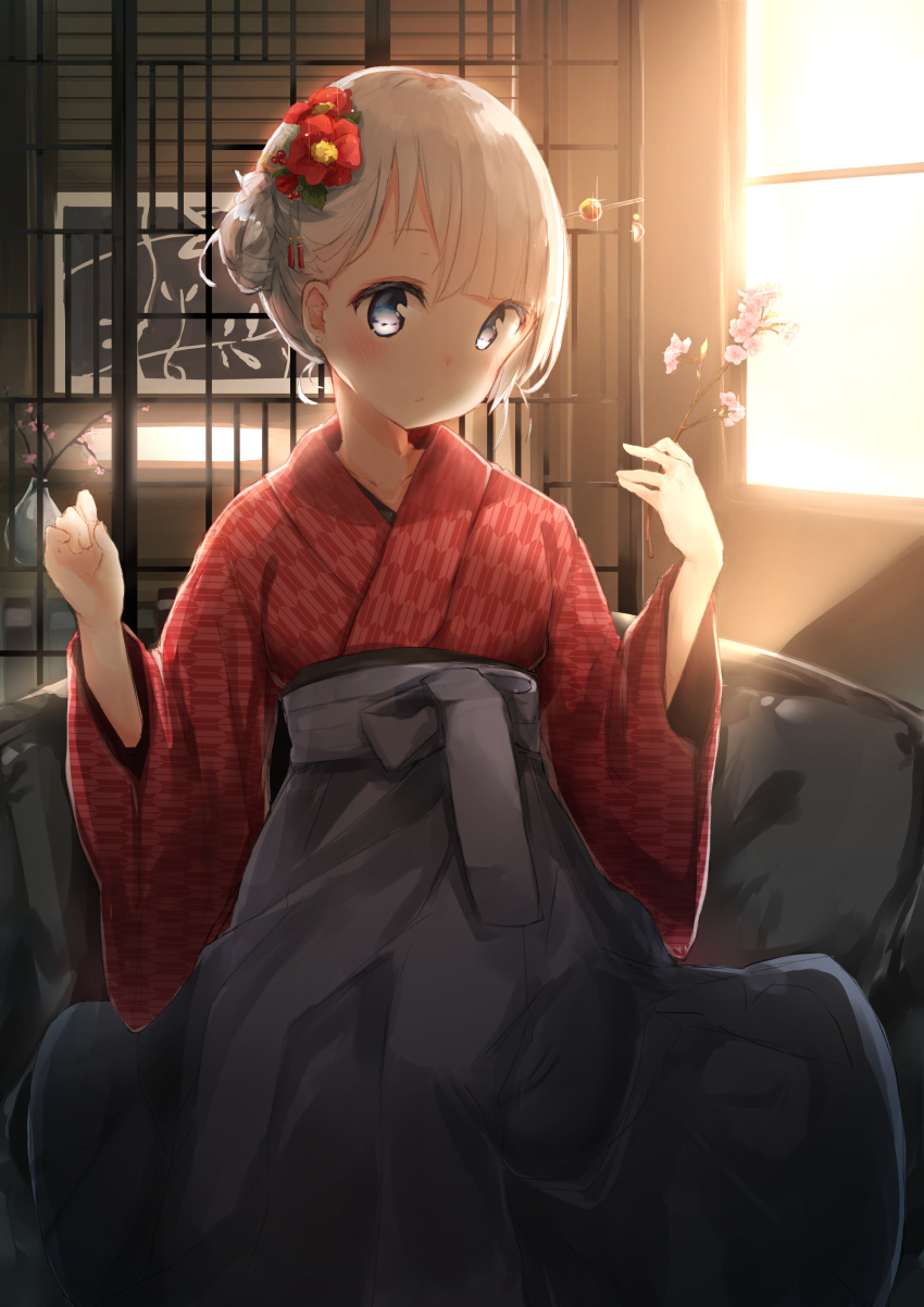 1girl absurdres asymmetrical_bangs bangs blue_eyes camellia_(flower) cherry_blossoms collarbone earrings expressionless flower grey_eyes grey_hakama hair_flower hair_ornament hair_stick hakama highres holding indoors japanese_clothes jewelry kimono long_sleeves nosetissue original pink_flower red_flower red_kimono short_hair side_bun silver_hair solo standing stud_earrings sunlight twig w_arms wide_sleeves window yagasuri