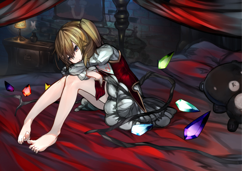 1girl bangs bare_legs barefoot blonde_hair brown_eyes closed_mouth crystal dress feet flandre_scarlet full_body indoors juliet_sleeves kusakanmuri lamp long_sleeves no_hat no_headwear on_bed portrait_(object) puffy_sleeves side_ponytail sitting solo stuffed_animal stuffed_toy teddy_bear toes touhou wings