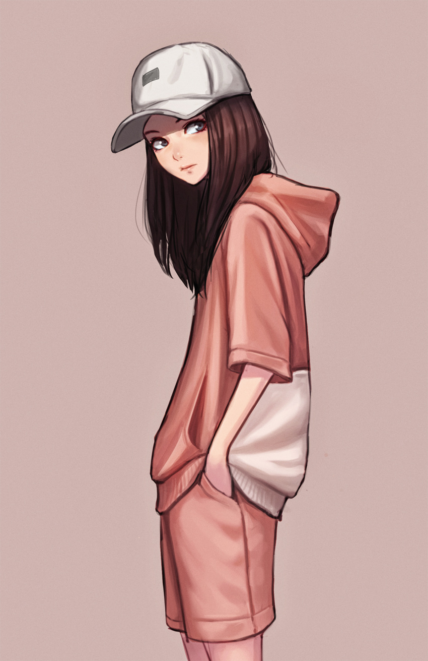 1girl baseball_cap brown_hair closed_mouth from_side hands_in_pockets hat highres hood hoodie jungon_kim long_hair looking_at_viewer original pink_background pink_shorts shorts simple_background solo white_hat