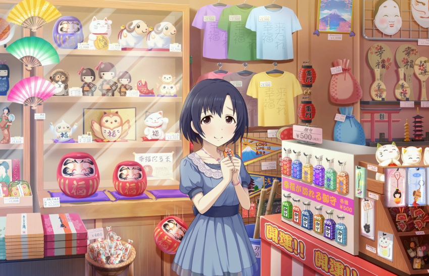 1girl bangs basket bell blue_dress blue_hair bob_cut bow charm_(object) closed_mouth clothes_hanger clothes_writing coin_purse collarbone daruma_doll display_case dress eyebrows_visible_through_hair eyelashes falling fan folding_fan hands_up holding indoors jewelry jingle_bell lantern looking_at_viewer maneki-neko necklace own_hands_together pale_skin paper_lantern parted_bangs pink_bow price_tag puffy_short_sleeves puffy_sleeves raised_eyebrows sack sash shirt shop short_hair short_sleeves sleeve_cuffs solo t-shirt translation_request