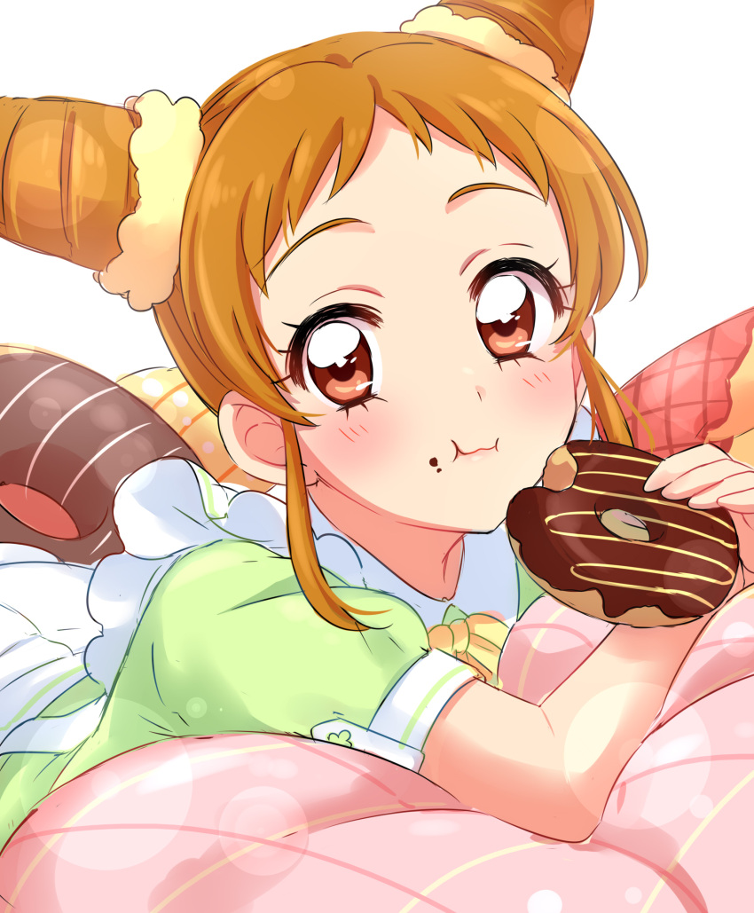 1girl :3 aikatsu! arisugawa_otome bangs blush brown_eyes closed_mouth doughnut eating food food_on_face green_shirt highres holding holding_food light_brown_hair looking_at_viewer lying on_stomach pillow sekina shirt short_hair short_sleeves simple_background solo white_background