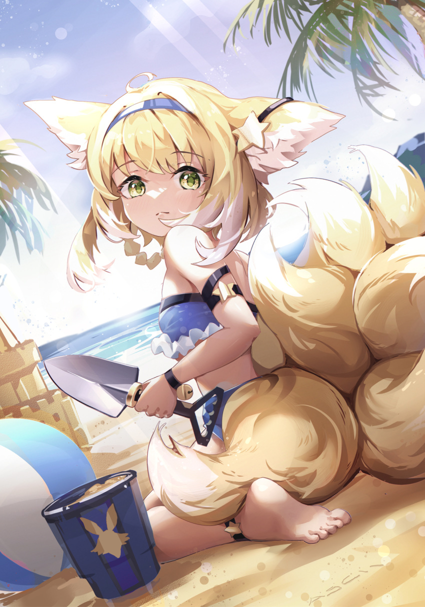 1girl animal_ears arknights asc11 ball bandeau bangs bare_arms bare_shoulders barefoot beach beachball bikini blonde_hair blue_bikini blue_hairband blue_sky bucket chinese_commentary commentary_request day eyebrows_visible_through_hair fox_ears fox_tail hair_ornament hairband highres holding holding_shovel multiple_tails outdoors palm_tree sand_castle sand_sculpture short_hair shovel sitting sky solo star_(symbol) star_hair_ornament strapless strapless_bikini suzuran_(arknights) swimsuit tail tree wariza yellow_eyes