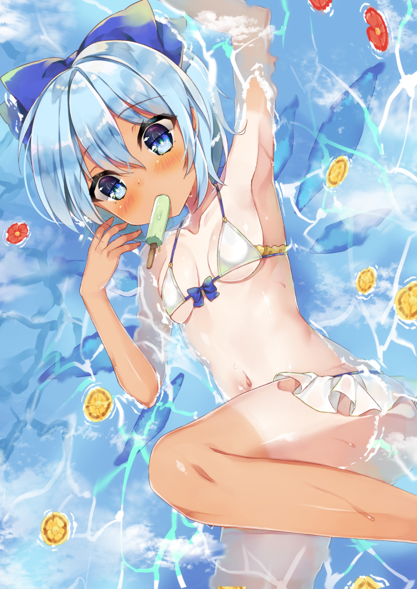 1girl armpits bikini bikini_skirt blue_bow blue_eyes blue_hair blush bow breasts cirno food food_in_mouth front-tie_top front_ponytail hair_bow halter_top halterneck highres ice ice_wings looking_at_viewer lying navel one-piece_tan popsicle small_breasts solo string_bikini swimsuit tan tanline touhou white_bikini wings yayoichi_(yoruyoru108)