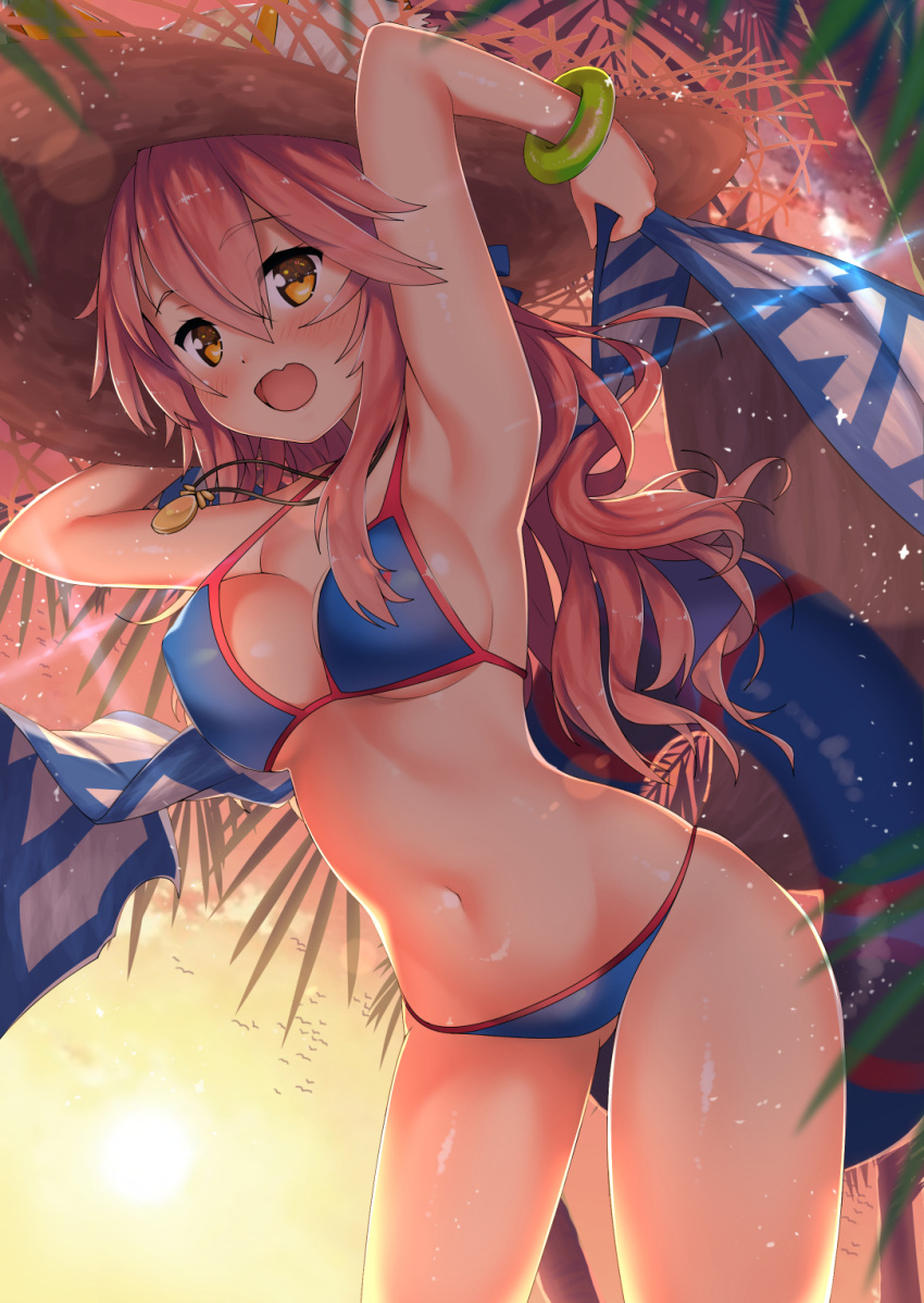 1girl armpits arms_up bangs bikini blue_bikini bracelet breasts brown_eyes contrapposto cowboy_shot evening eyebrows_visible_through_hair fate/grand_order fate_(series) hat highres hips innertube jewelry kawai long_hair looking_at_viewer medium_breasts navel open_mouth outdoors pink_hair smile solo straw_hat sun_hat swimsuit tamamo_(fate)_(all) tamamo_no_mae_(swimsuit_lancer)_(fate) thighs wavy_hair