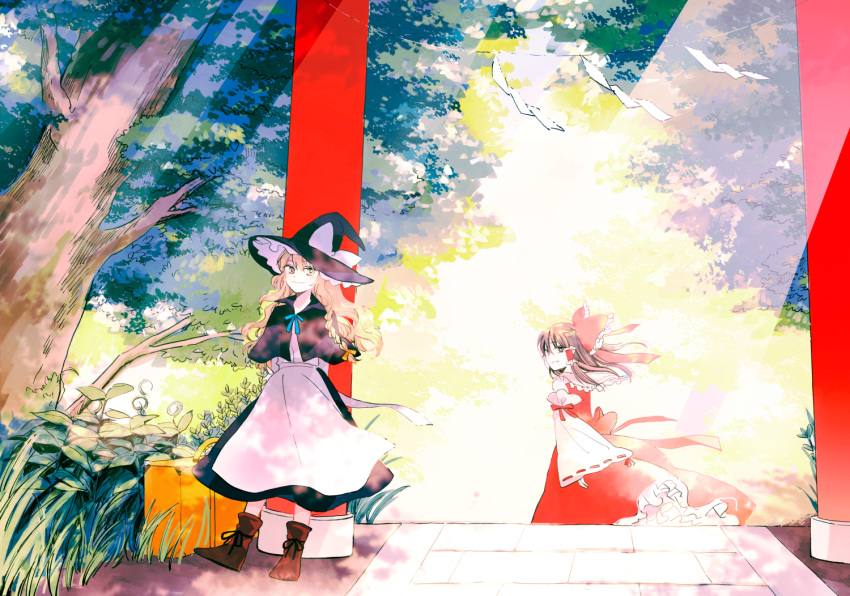 2girls apron arms_behind_back black_eyes black_hair blonde_hair braid brown_eyes brown_hair capelet detached_sleeves dress hair_ribbon hair_tubes hakurei_reimu hat kirisame_marisa long_hair looking_at_viewer multiple_girls nontraditional_miko outdoors plant ribbon smile suitcase sunlight torii touhou tree wide_sleeves witch_hat yellow_eyes yonu_(yonurime)