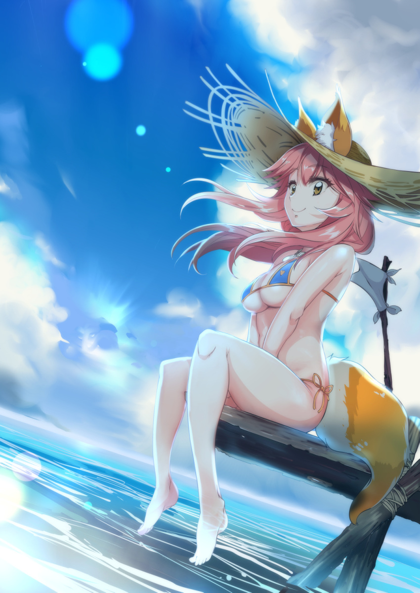 1girl animal_ears bikini blue_bikini breasts cleavage commentary_request day ears_through_headwear fate/extra fate/grand_order fate_(series) fox_ears fox_tail grimjin hat highres large_breasts long_hair navel ocean outdoors pink_hair sitting solo swimsuit tail tamamo_(fate)_(all) tamamo_no_mae_(swimsuit_lancer)_(fate) yellow_eyes
