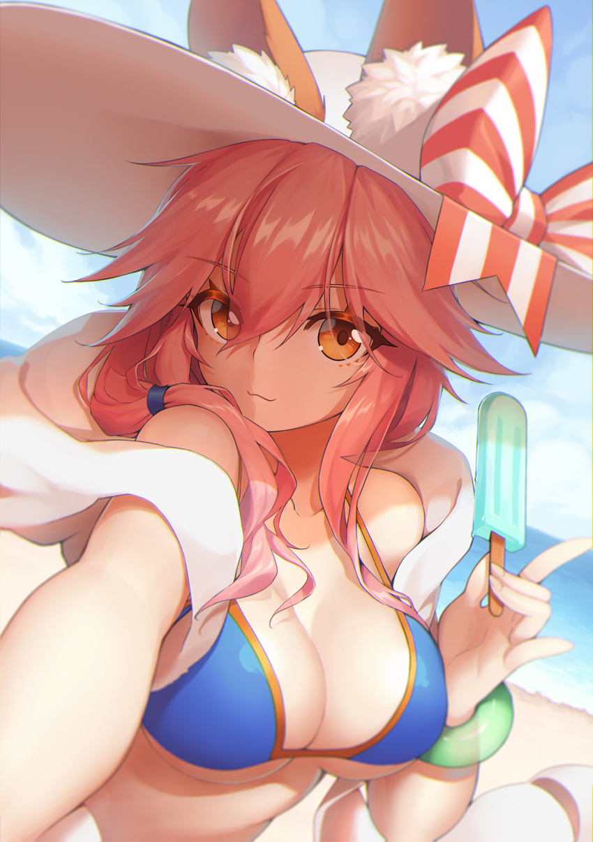 1girl :3 animal_ears beach bikini_top blue_bikini_top blue_sky blurry bow bracelet breasts cleavage closed_mouth day depth_of_field dutch_angle eyebrows_visible_through_hair eyes_visible_through_hair fate/grand_order fate_(series) food fox_ears hair_between_eyes hair_over_shoulder hat hat_bow highres horizon jewelry large_breasts long_hair looking_at_viewer neko7 orange_eyes outdoors pink_hair pinky_out popsicle sky solo sun_hat tamamo_(fate)_(all) tamamo_no_mae_(swimsuit_lancer)_(fate) upper_body