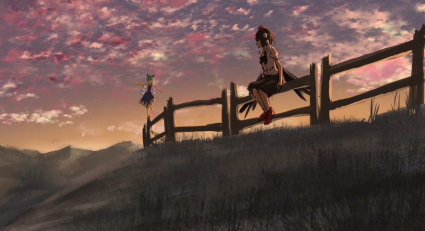 2girls balancing barefoot bird_wings black_hair black_skirt black_wings blue_bow blue_dress bow cirno clouds cloudy_sky commentary_request dress feathered_wings fence grass hair_bow hat ice ice_wings multiple_girls nature outdoors pom_pom_(clothes) puffy_short_sleeves puffy_sleeves red_shoes roke_(taikodon) shameimaru_aya shirt shoes short_sleeves sitting skirt sky sunset tokin_hat touhou white_shirt wings