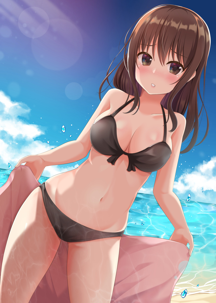 1girl aibumi bangs beach bikini black_bikini blue_sky blush breasts brown_eyes brown_hair clouds cloudy_sky collarbone day eyebrows_visible_through_hair hair_between_eyes highres holding_towel large_breasts lens_flare light_rays long_hair looking_at_viewer navel ocean original outdoors parted_lips sky solo standing sunbeam sunlight swimsuit thighs