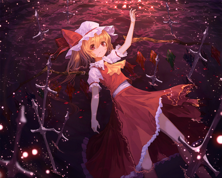 1girl arm_up ascot bangs blonde_hair closed_mouth flandre_scarlet hat hat_ribbon highres lo-ta long_hair long_skirt looking_at_viewer lying mob_cap partially_submerged planted_sword planted_weapon red_eyes red_ribbon red_skirt ribbon skirt skirt_set solo sword touhou vest weapon white_hat wings