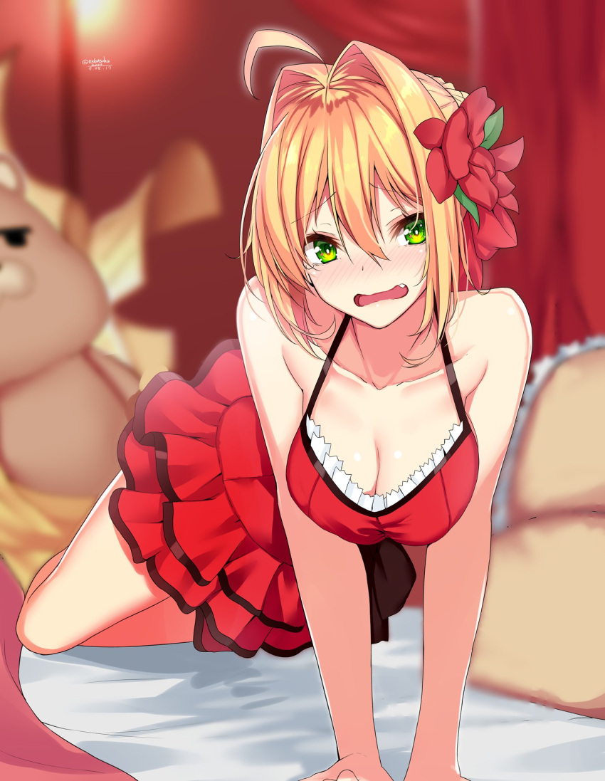 1girl ahoge arm_support bare_shoulders bed blonde_hair blush breasts cleavage collarbone dress eyebrows_visible_through_hair fang fate/extra fate/grand_order fate_(series) flower green_eyes hair_between_eyes hair_flower hair_intakes hair_ornament highres looking_at_viewer medium_breasts nebusoku on_bed open_mouth pillow red_dress saber_extra sleeveless sleeveless_dress solo stuffed_toy v_arms