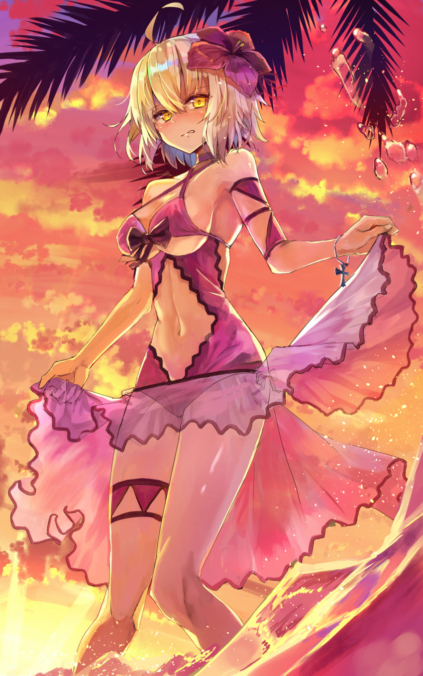 1girl ahoge ankh bikini blonde_hair blush bow bracelet breasts cleavage clouds criss-cross_halter cross evening eyebrows_visible_through_hair fate/grand_order fate_(series) flower hair_flower hair_ornament halterneck highres hopepe jeanne_alter jewelry legs_together looking_at_viewer medium_breasts navel orange_sky palm_tree purple_bikini ruler_(fate/apocrypha) see-through short_hair skindentation sky solo splashing standing sunset swimsuit thigh_strap tree under_boob wading water wrist_straps yellow_eyes