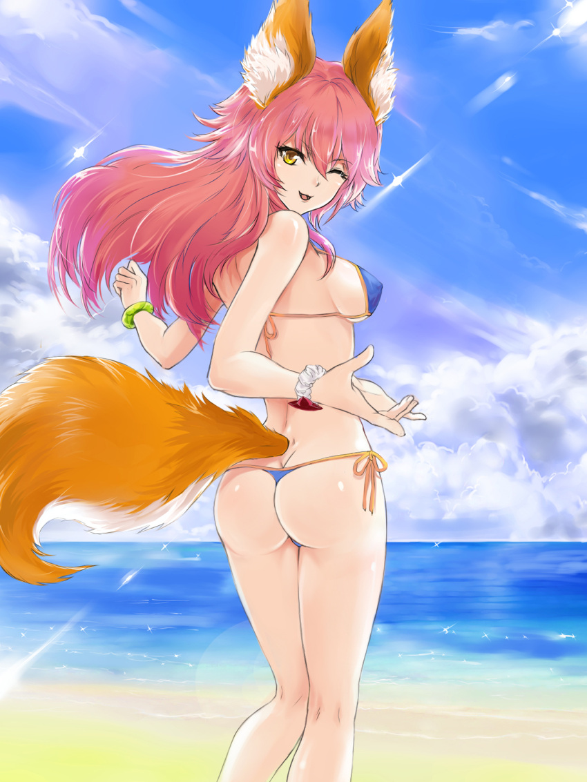 1girl animal_ears ass beach bikini blue_bikini breasts day fangs fate/grand_order fate_(series) fengya fox_ears fox_tail highres large_breasts long_hair looking_at_viewer looking_back ocean one_eye_closed open_mouth outdoors pink_hair sideboob solo swimsuit tail tamamo_(fate)_(all) tamamo_no_mae_(swimsuit_lancer)_(fate) yellow_eyes