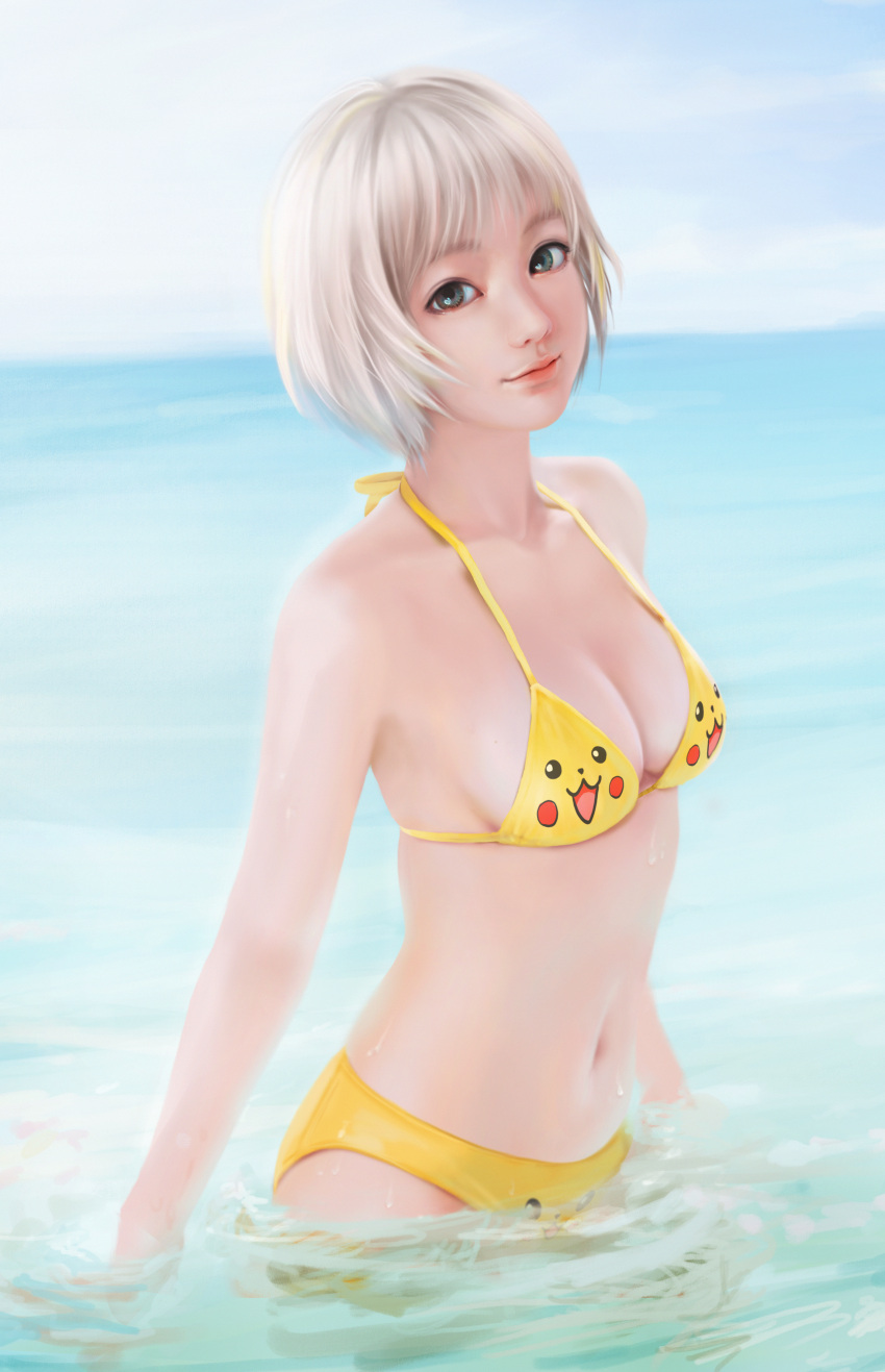 1girl absurdres arms_at_sides beach bikini blonde_hair breasts cleavage closed_mouth commentary_request day green_eyes halter_top halterneck highres huge_filesize jintawat_puttanawiboon lips looking_at_viewer medium_breasts navel nose original outdoors partially_submerged pikachu red_lips short_hair sideboob smile solo standing stomach sunlight swimsuit thai water yellow_bikini