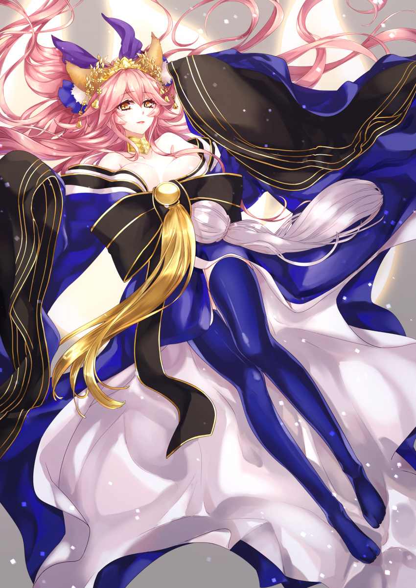 1girl animal_ears bell blue_legwear breasts cleavage collarbone detached_sleeves fate/extra fate/grand_order fate_(series) fox_ears fox_tail hair_ribbon highres japanese_clothes kasuitokihi large_breasts long_hair looking_at_viewer lying multiple_tails open_mouth pink_hair ribbon solo tail tamamo_(fate)_(all) tamamo_no_mae_(fate) very_long_hair yellow_eyes