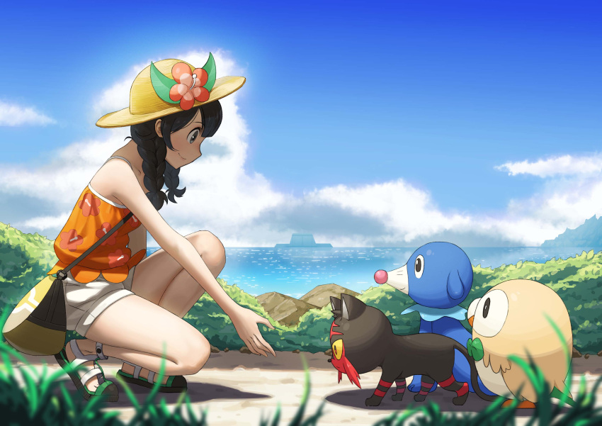 1girl absurdres bag bare_arms black_hair blue_sky blurry braid clouds day depth_of_field flower from_side full_body grass hat highres kneeling litten mizuki_(pokemon_ultra_sm) nature neko_sheep ocean outdoors pokemon pokemon_(game) pokemon_ultra_sm popplio reaching_out rowlet sandals shorts sky smile solo tank_top twin_braids water white_shorts