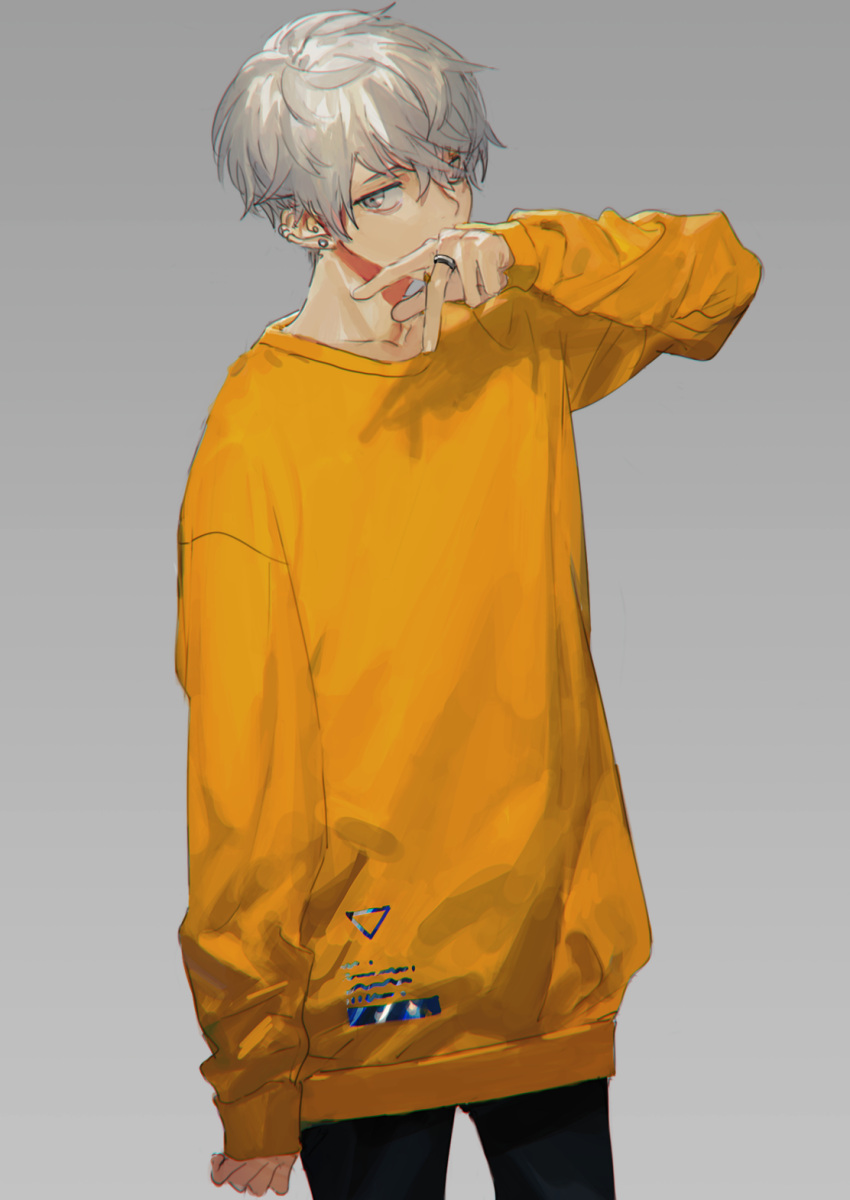 1boy bangs black_pants covered_mouth cowboy_shot earrings grey_background hair_between_eyes hand_up highres hirota_tsuu jewelry long_sleeves male_focus original pants ring silver_hair simple_background solo standing sweater yellow_eyes yellow_sweater
