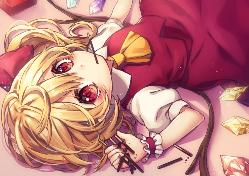 1girl ascot blonde_hair commentary_request flandre_scarlet food hair_between_eyes hair_ribbon holding kyouda_suzuka long_hair looking_at_viewer lying mouth_hold nail_polish on_back pocky puffy_short_sleeves puffy_sleeves red_eyes red_nails red_ribbon red_skirt ribbon short_sleeves skirt skirt_set solo touhou vest wings wrist_cuffs