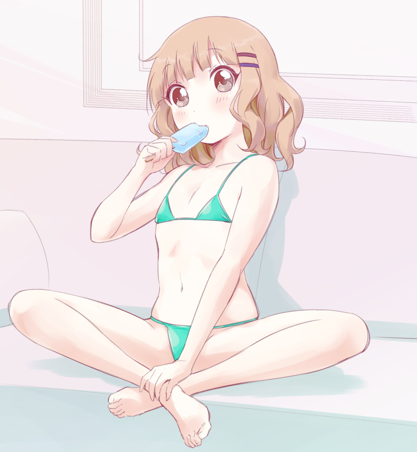 1girl absurdres barefoot bikini blush couch crossed_ankles eating flat_chest food full_body green_bikini hair_ornament hairclip highres indoors kamiki_uutarou light_brown_hair navel on_couch oomuro_sakurako popsicle sitting solo string_bikini swimsuit wavy_hair yuru_yuri