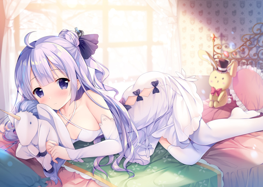 1girl ahoge azur_lane bed bed_sheet commentary_request curtains detached_sleeves dress hair_bun highres long_hair looking_at_viewer lying on_stomach one_side_up pillow purple_hair side_bun smile solo sousouman stuffed_animal stuffed_bunny stuffed_pegasus stuffed_toy stuffed_unicorn unicorn_(azur_lane) violet_eyes white_dress window