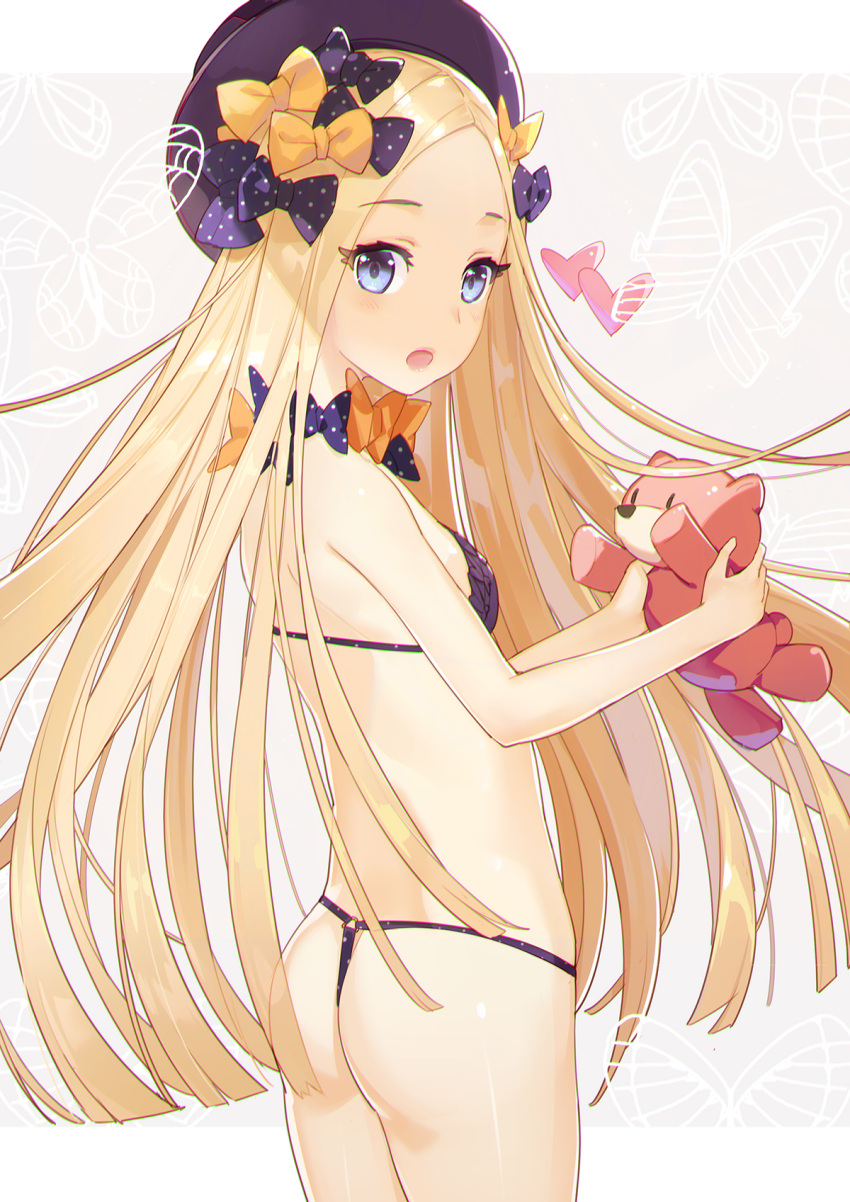 1girl :o abigail_williams_(fate/grand_order) ass bare_arms bare_shoulders bikini blonde_hair blue_eyes bow breasts butterfly commentary_request cowboy_shot el-zheng eyebrows_visible_through_hair eyelashes fate/grand_order fate_(series) from_behind grey_background hair_bow hat heart highres holding holding_stuffed_animal long_hair looking_at_viewer looking_back orange_bow pink_lips polka_dot polka_dot_bow purple_bikini purple_bow small_breasts solo standing stuffed_animal stuffed_toy swimsuit teddy_bear thong_bikini very_long_hair