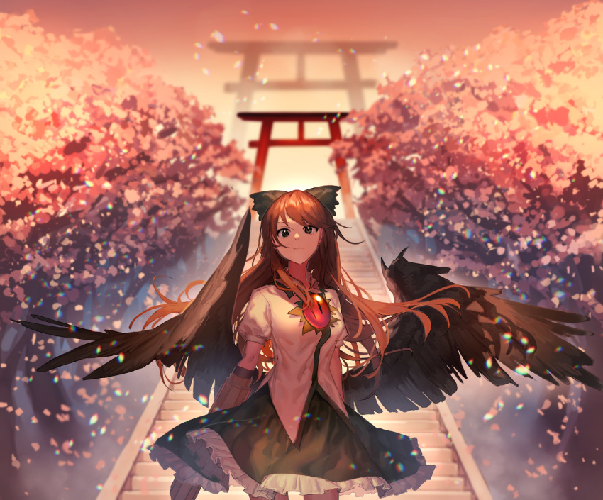 1girl arch arms_at_sides bangs black_wings blurry bow brown_hair cherry_blossoms cowboy_shot depth_of_field feathered_wings frilled_skirt frills green_bow green_eyes hair_bow highres light_particles long_hair looking_at_viewer medium_skirt motsuba orange_sky outdoors petals puffy_short_sleeves puffy_sleeves reiuji_utsuho serious shirt short_sleeves skirt sky solo standing third_eye torii touhou tree twilight very_long_hair white_shirt wings