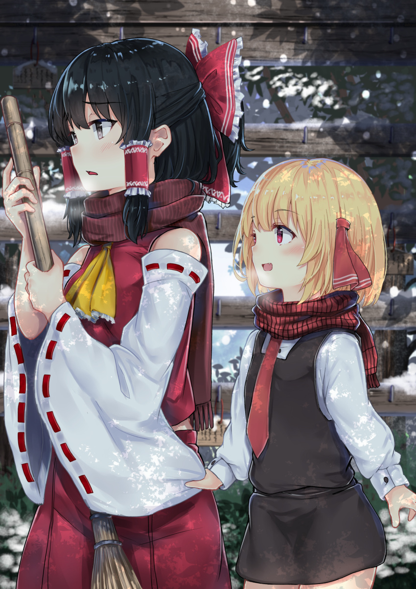 2girls absurdres ascot black_eyes black_hair black_skirt blonde_hair bow breath broom commentary_request detached_sleeves fang from_side hair_bow hair_ribbon hair_tubes hakurei_reimu highres long_sleeves miniskirt multiple_girls necktie open_mouth outdoors pink_eyes red_bow red_neckwear red_skirt ribbon ribbon-trimmed_sleeves ribbon_trim rumia scarf sidelocks skirt skirt_set smile touhou vest winter wowoguni yellow_neckwear