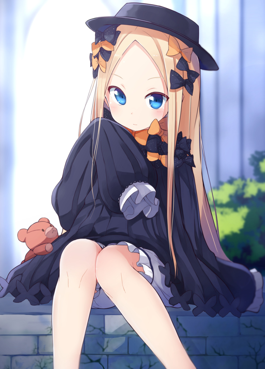abigail_williams_(fate/grand_order) bangs black_bow black_hat blonde_hair blue_eyes bow fate/grand_order fate_(series) forehead gothic_lolita hair_bow hat highres lolita_fashion long_hair long_sleeves looking_at_viewer okota_mikan orange_bow parted_bangs polka_dot polka_dot_bow sitting sleeves_past_wrists stuffed_animal stuffed_toy teddy_bear white_bloomers