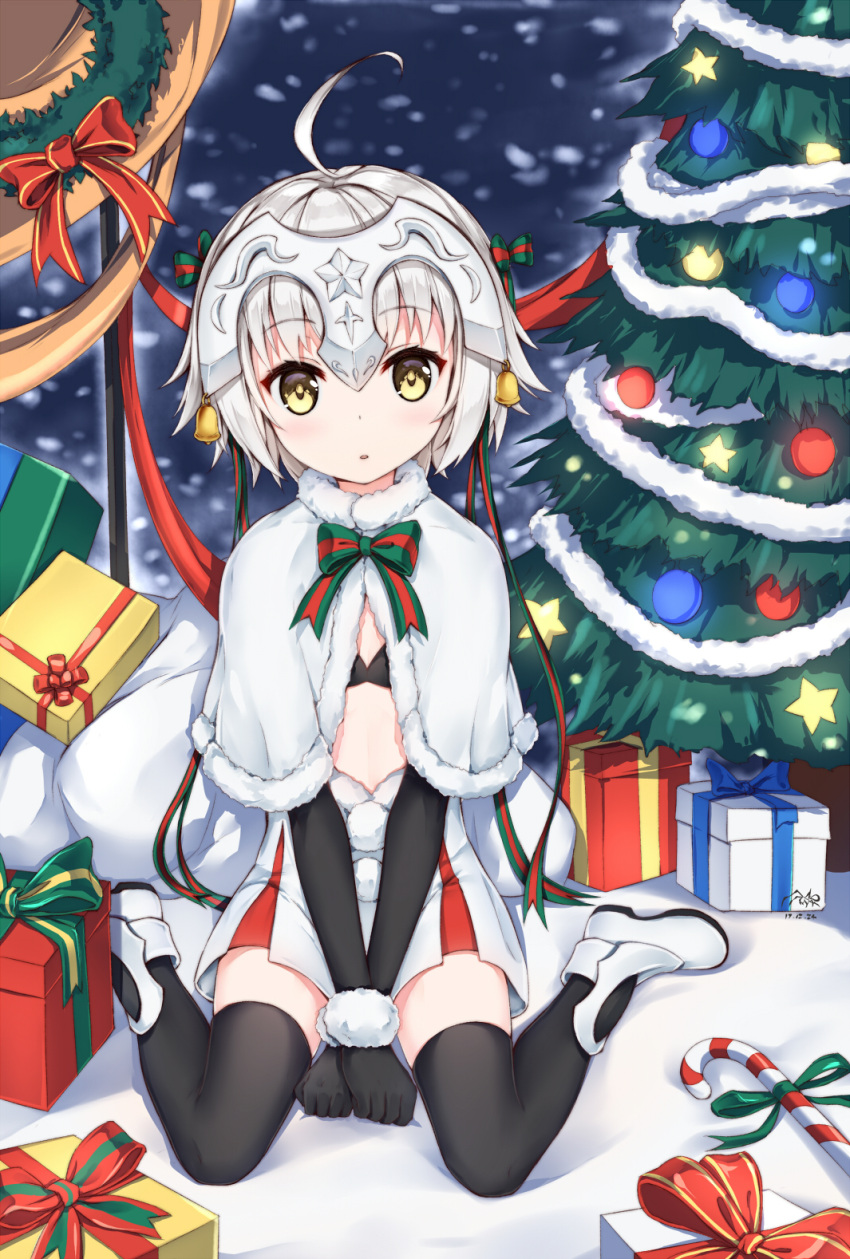 1girl :o ahoge bell black_bikini_top black_gloves black_legwear boots bow box candy candy_cane capelet christmas_tree elbow_gloves fate/grand_order fate_(series) food full_body fur_trim gift gift_box gloves green_ribbon headpiece highres jeanne_d'arc_(fate)_(all) jeanne_d'arc_alter_santa_lily looking_at_viewer pom_pom_(clothes) ribbon shibanme_tekikumo short_hair silver_hair sitting skirt solo striped striped_bow striped_ribbon v_arms wariza white_capelet white_footwear yellow_eyes