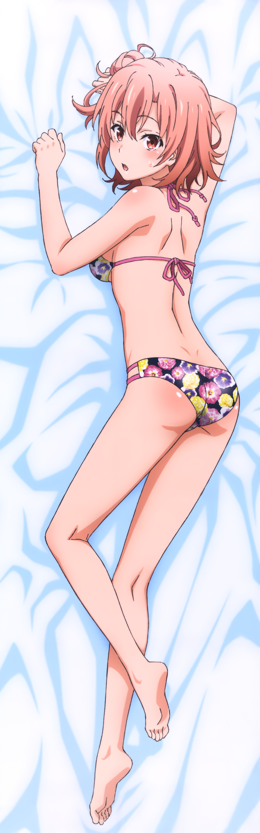 1girl absurdres ass barefoot bed_sheet bikini breasts dakimakura eyebrows_visible_through_hair feet from_above hair_between_eyes highres looking_at_viewer looking_back lying medium_breasts on_stomach open_mouth orange_hair red_eyes shiny shiny_skin short_hair sideboob soles solo swimsuit toes yahari_ore_no_seishun_lovecome_wa_machigatteiru. yuigahama_yui