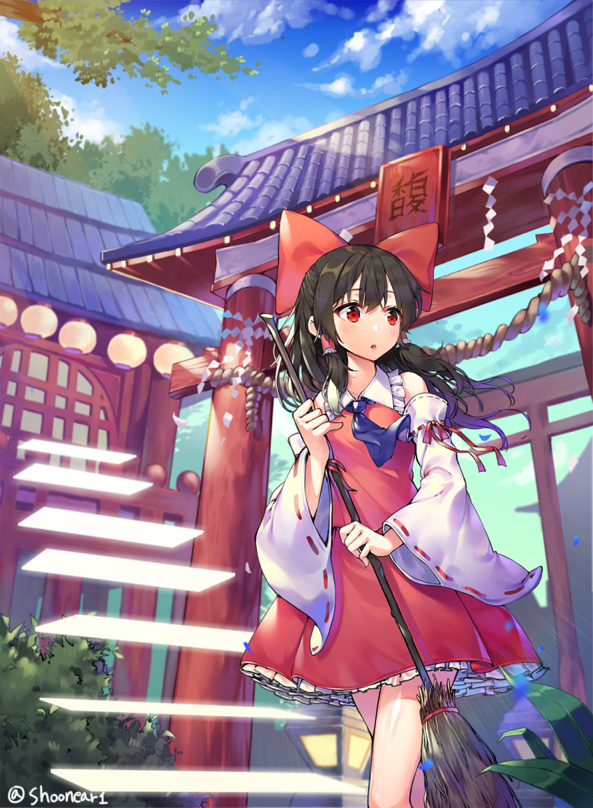 1girl :o architecture black_hair blue_sky bow broom clouds day detached_sleeves east_asian_architecture hair_bow hair_tubes hakurei_reimu highres holding lantern long_hair miniskirt outdoors red_bow red_eyes ribbon-trimmed_sleeves ribbon_trim rope shide shimenawa shoonear shrine skirt skirt_set sky solo torii touhou tree twitter_username vest