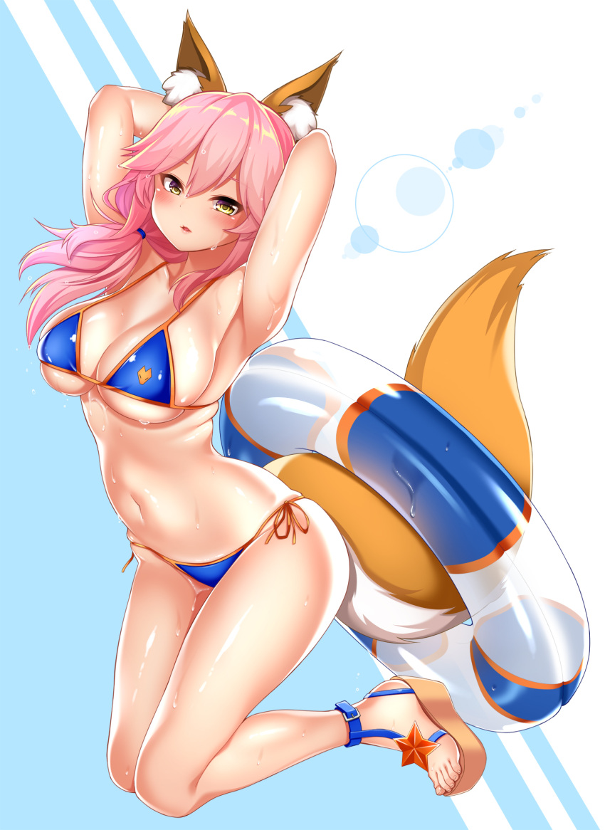 animal_ears arms_behind_back arms_behind_head bikini blue_bikini blush breasts cleavage collarbone commentary_request fate/grand_order fate_(series) fox_ears fox_tail groin highres innertube kashima_mashino large_breasts looking_at_viewer navel pink_hair side-tie_bikini sweat swimsuit tail tamamo_(fate)_(all) tamamo_no_mae_(swimsuit_lancer)_(fate) yellow_eyes